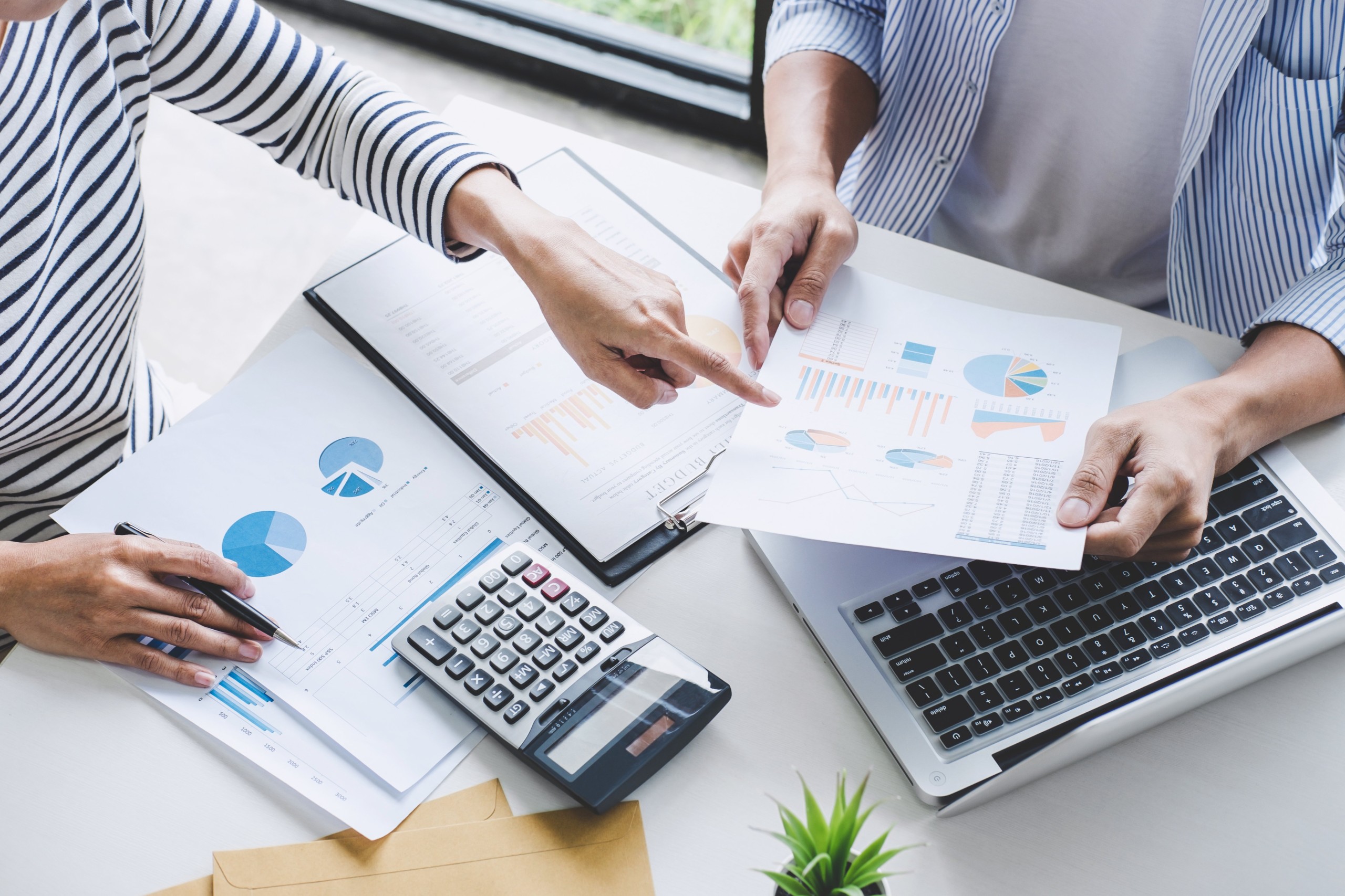 Business team collaboration discussing working analysis with financial data and marketing growth report graph in team, Meeting Talking Brainstorming Communication Concept
